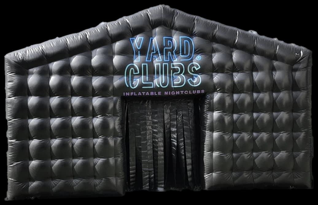 The Large club from the front: a black quilted inflatable nightclub with the Yard Clubs sign over its curtained door